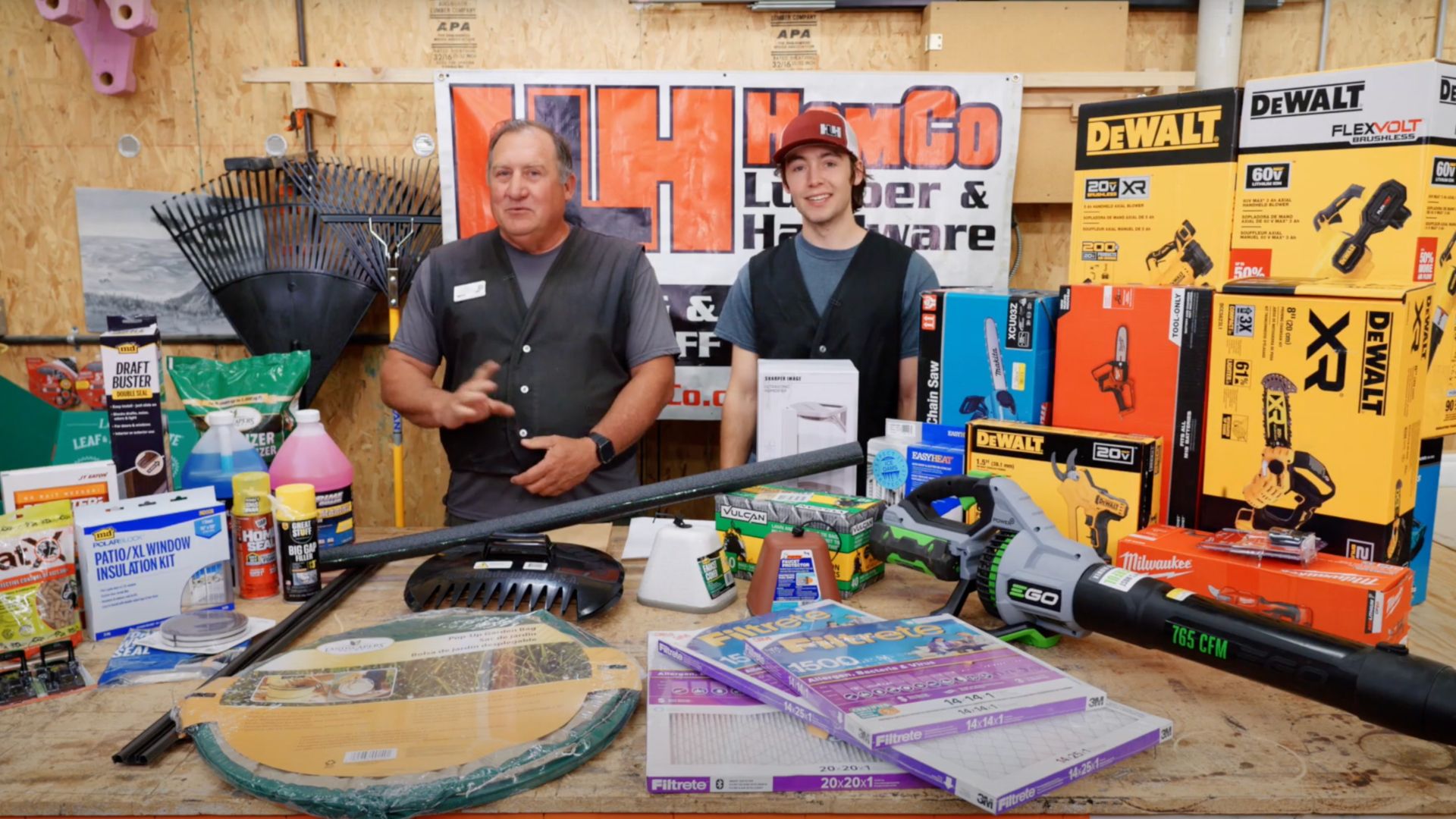 jay and mix smiling with all the home prep for fall products on a table